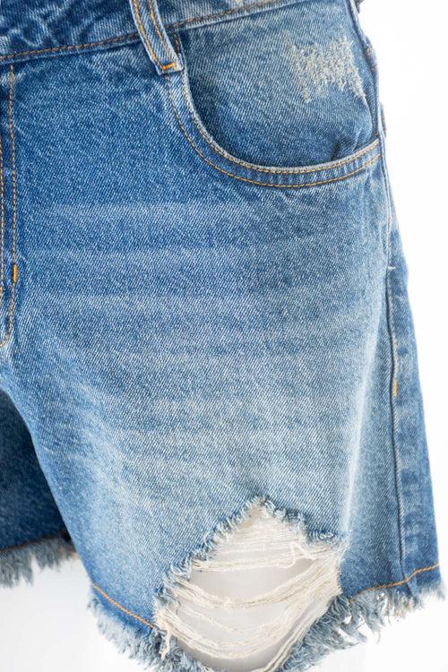 Card slide image -  SHORT DE MOVIES EN DENIM TONO MEDIO CON ROTOS PARA MUJER